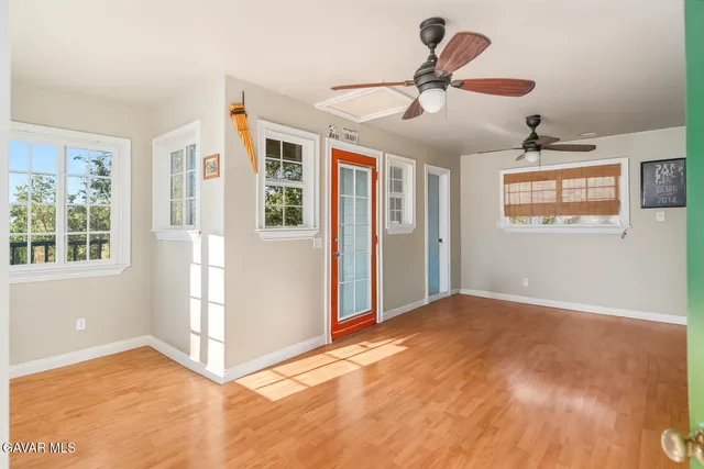 a view of a balcony with wooden floor and outdoor space