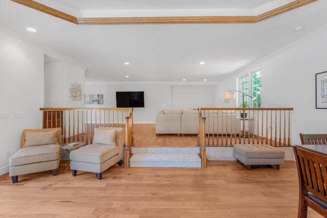 a white bath tub sitting in a bathroom next to a window