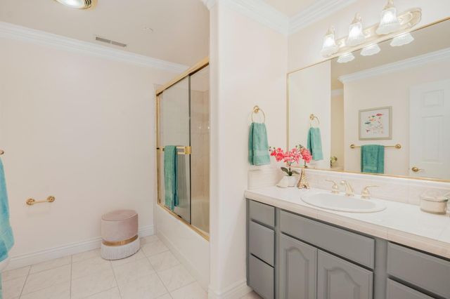 a view of a patio with table and chairs and potted plants