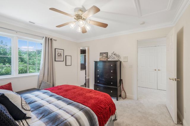 a living room with furniture a clock and a fireplace