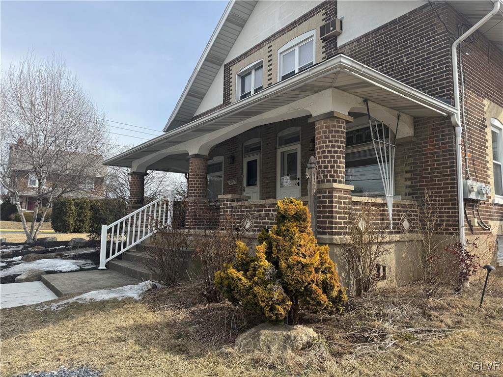 807 Chestnut Street, Unit 1 Coplay, PA 18037 - Photo 1 of 28 a front view of a house with garden