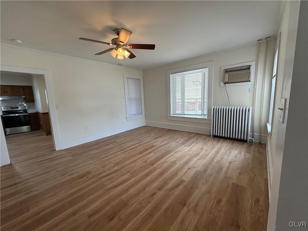 807 Chestnut Street, Unit 1 Coplay, PA 18037 - Photo 11 of 28 a view of an empty room with a window and wooden floor