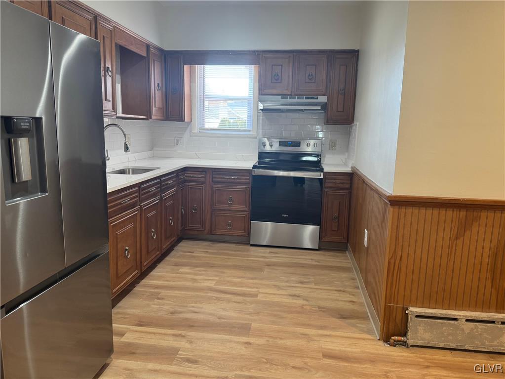 807 Chestnut Street, Unit 1 Coplay, PA 18037 - Photo 12 of 28 a kitchen with stainless steel appliances granite countertop a stove a sink and a refrigerator