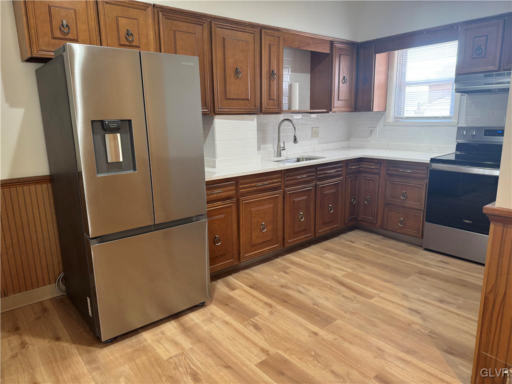 807 Chestnut Street, Unit 1 Coplay, PA 18037 - Photo 13 of 28 a kitchen with stainless steel appliances granite countertop a refrigerator sink and cabinets