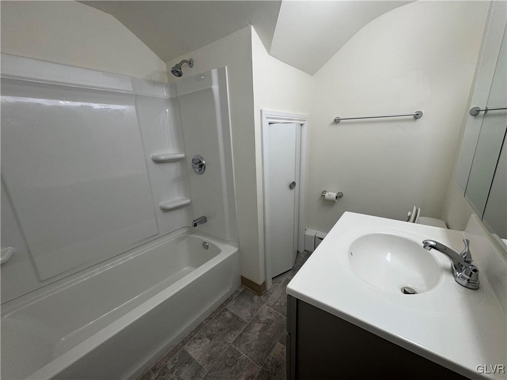 807 Chestnut Street, Unit 1 Coplay, PA 18037 - Photo 20 of 28 a bathroom with a tub sink vanity and mirror