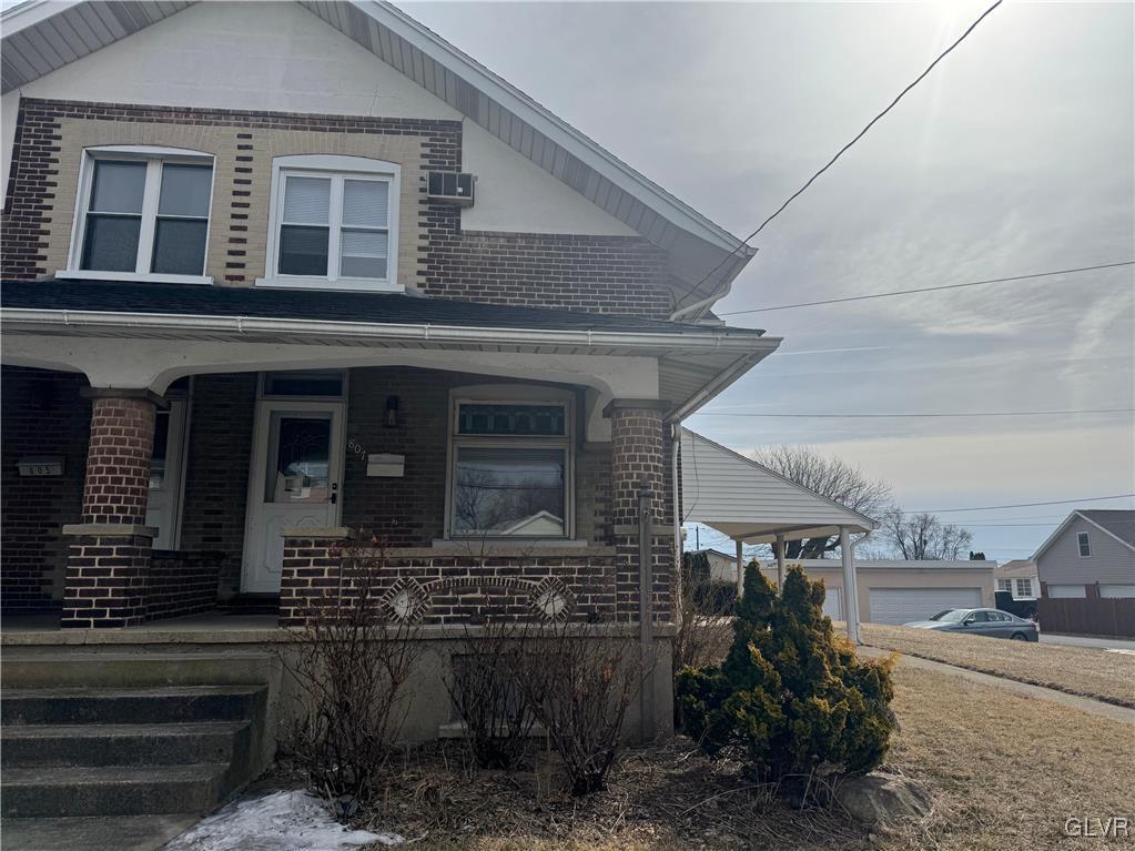 807 Chestnut Street, Unit 1 Coplay, PA 18037 - Photo 2 of 28 a front view of a house with garage