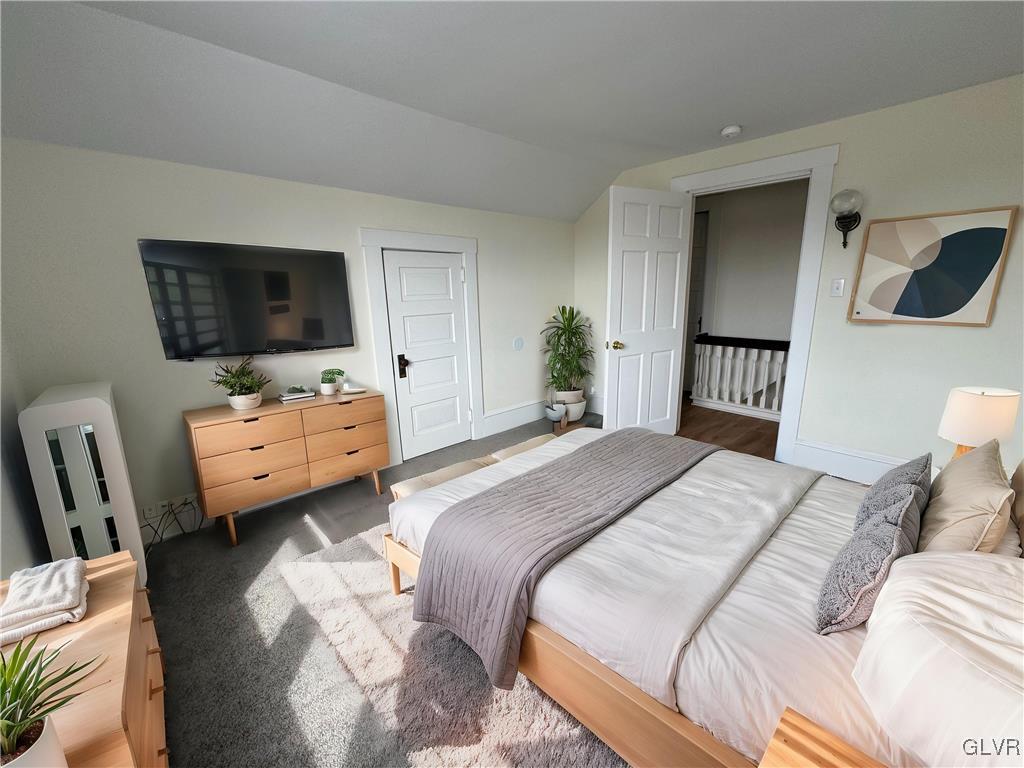 807 Chestnut Street, Unit 1 Coplay, PA 18037 - Photo 24 of 28 a bedroom with a bed and a flat screen tv