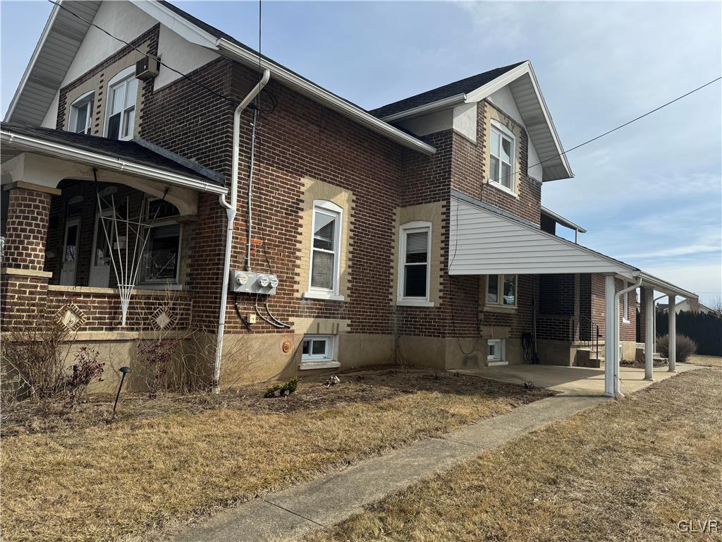 807 Chestnut Street, Unit 1 Coplay, PA 18037 - Photo 27 of 28 a view of a house with backyard and chairs