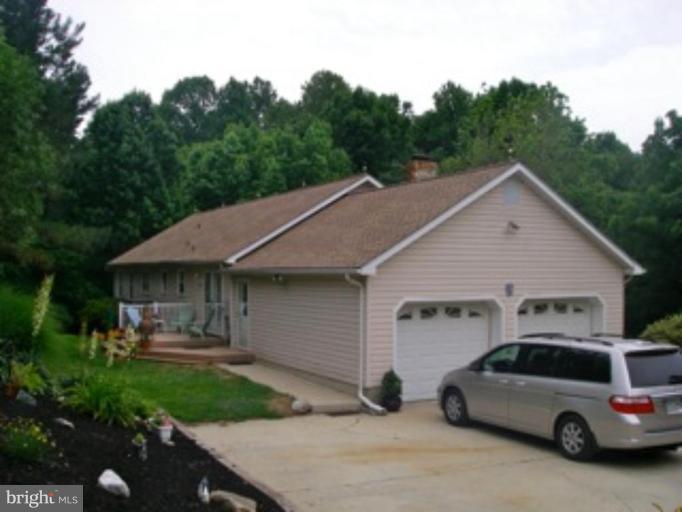 3139 Bayside Road Huntingtown, MD 20639 - Photo 1 of 30 a view of a car parked in front of a house