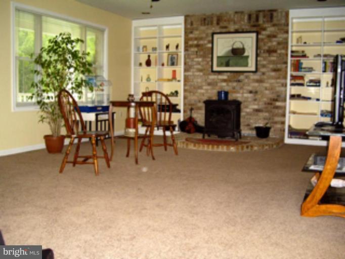 3139 Bayside Road Huntingtown, MD 20639 - Photo 29 of 30 a view of a livingroom with furniture and a flat screen tv