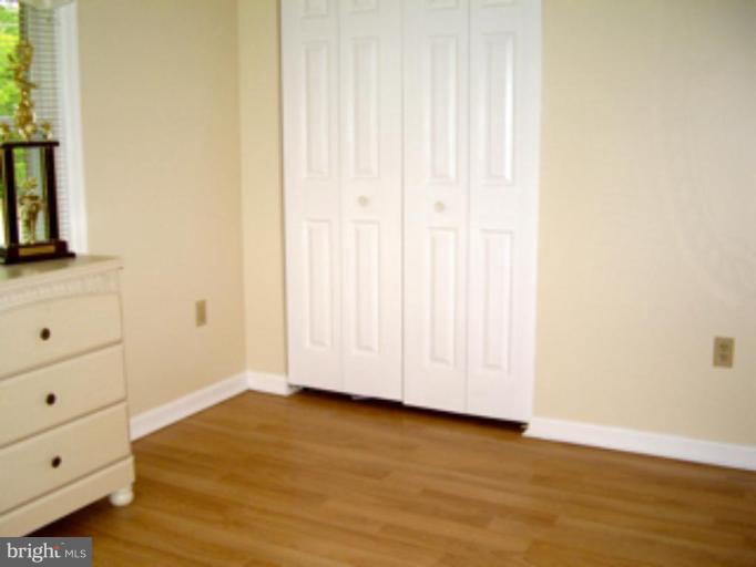 3139 Bayside Road Huntingtown, MD 20639 - Photo 13 of 30 a view of a room with wooden floor and cabinet