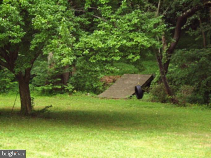 3139 Bayside Road Huntingtown, MD 20639 - Photo 21 of 30 a view of a garden with a trees