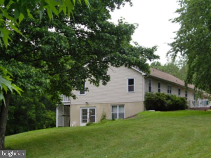 3139 Bayside Road Huntingtown, MD 20639 - Photo 24 of 30 a house that is sitting in the grass
