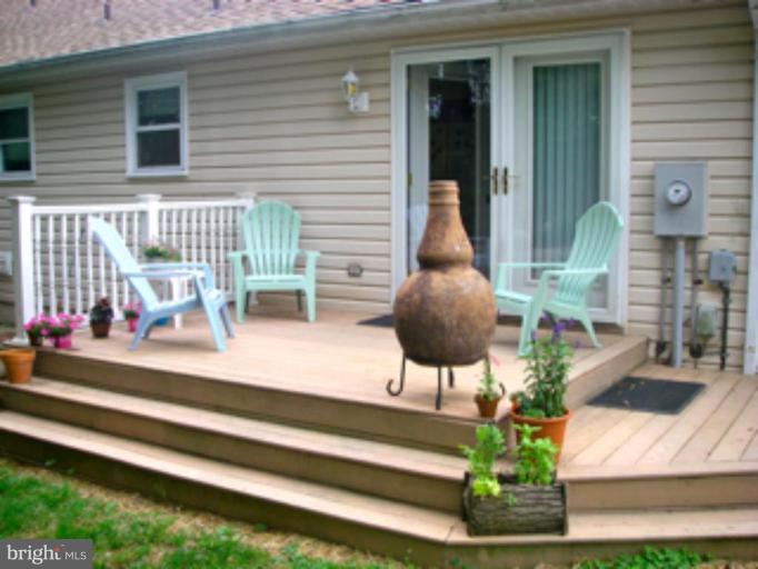 3139 Bayside Road Huntingtown, MD 20639 - Photo 4 of 30 a view of a house with a porch and furniture