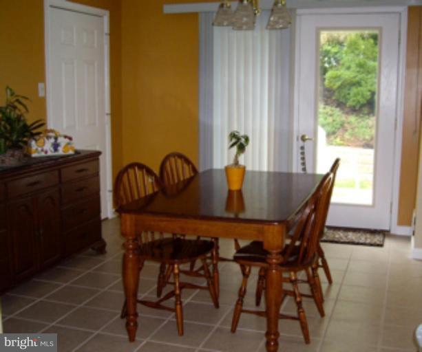 3139 Bayside Road Huntingtown, MD 20639 - Photo 10 of 30 a view of a dining room with furniture and window