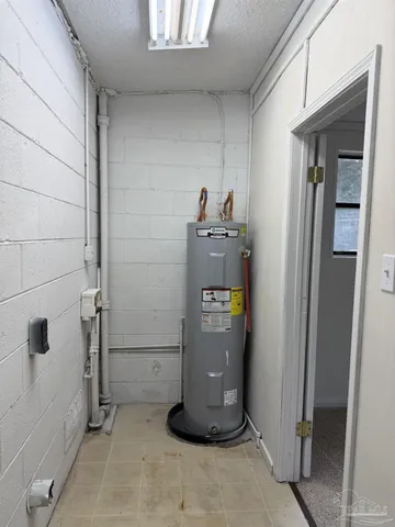 a room with water heater and storage