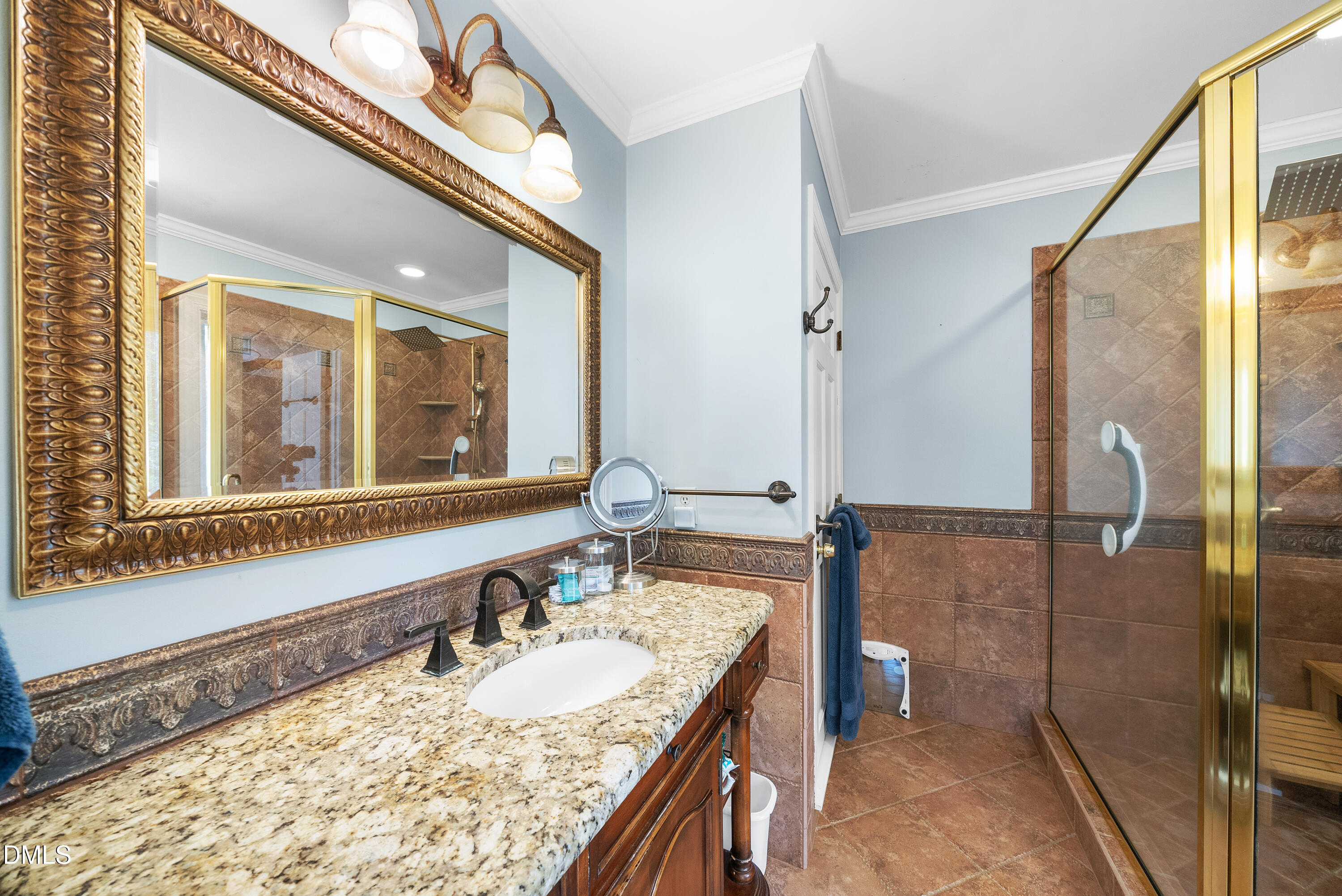 6200 Splitrock Trail Apex, NC 27539 - Photo 22 of 64 a bathroom with a granite countertop sink and a mirror
