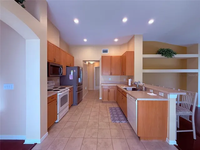 a large kitchen with stainless steel appliances