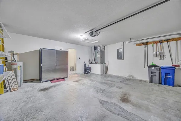 a large kitchen with cabinets and wooden floor