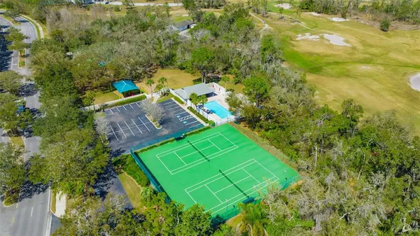 an aerial view of a house with a big yard