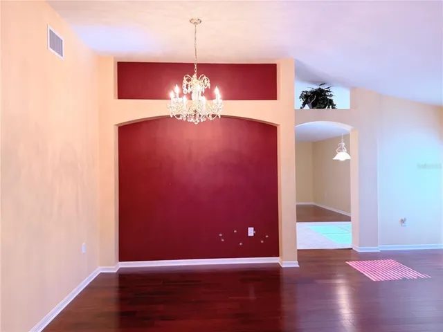 a view of a livingroom with wooden floor