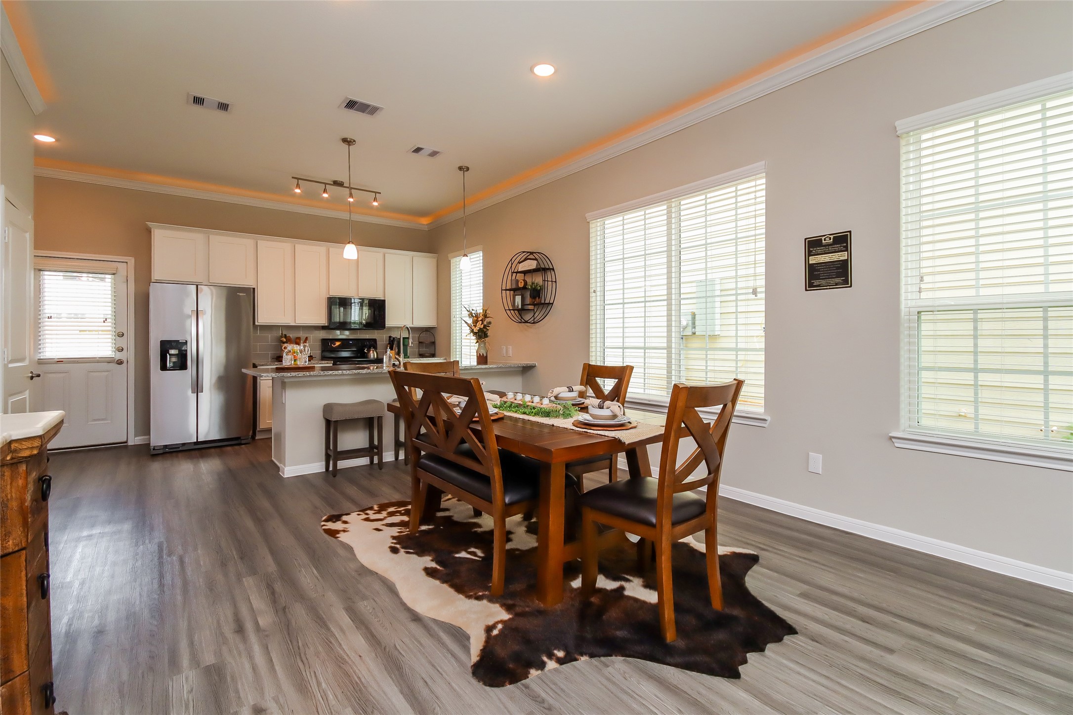 19422 Sparrow Trail Rosharon, TX 77583 - Photo 3 of 24 a view of a dining room with furniture and wooden floor