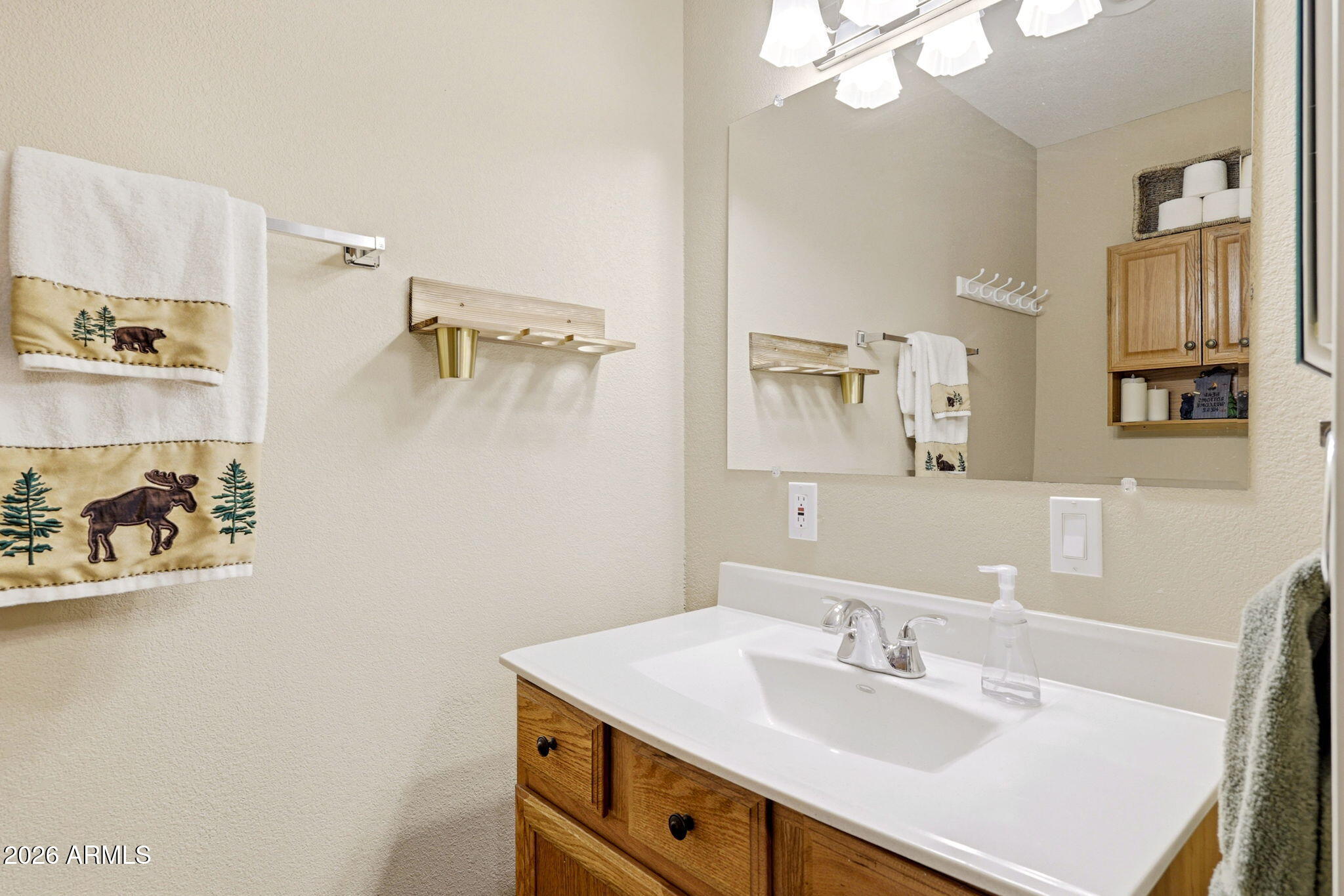 2112 Fishermans Road Overgaard, AZ 85933 - Photo 8 of 18 a bathroom with a sink vanity and a mirror