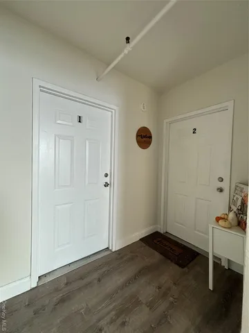 a view of a livingroom with wooden floor