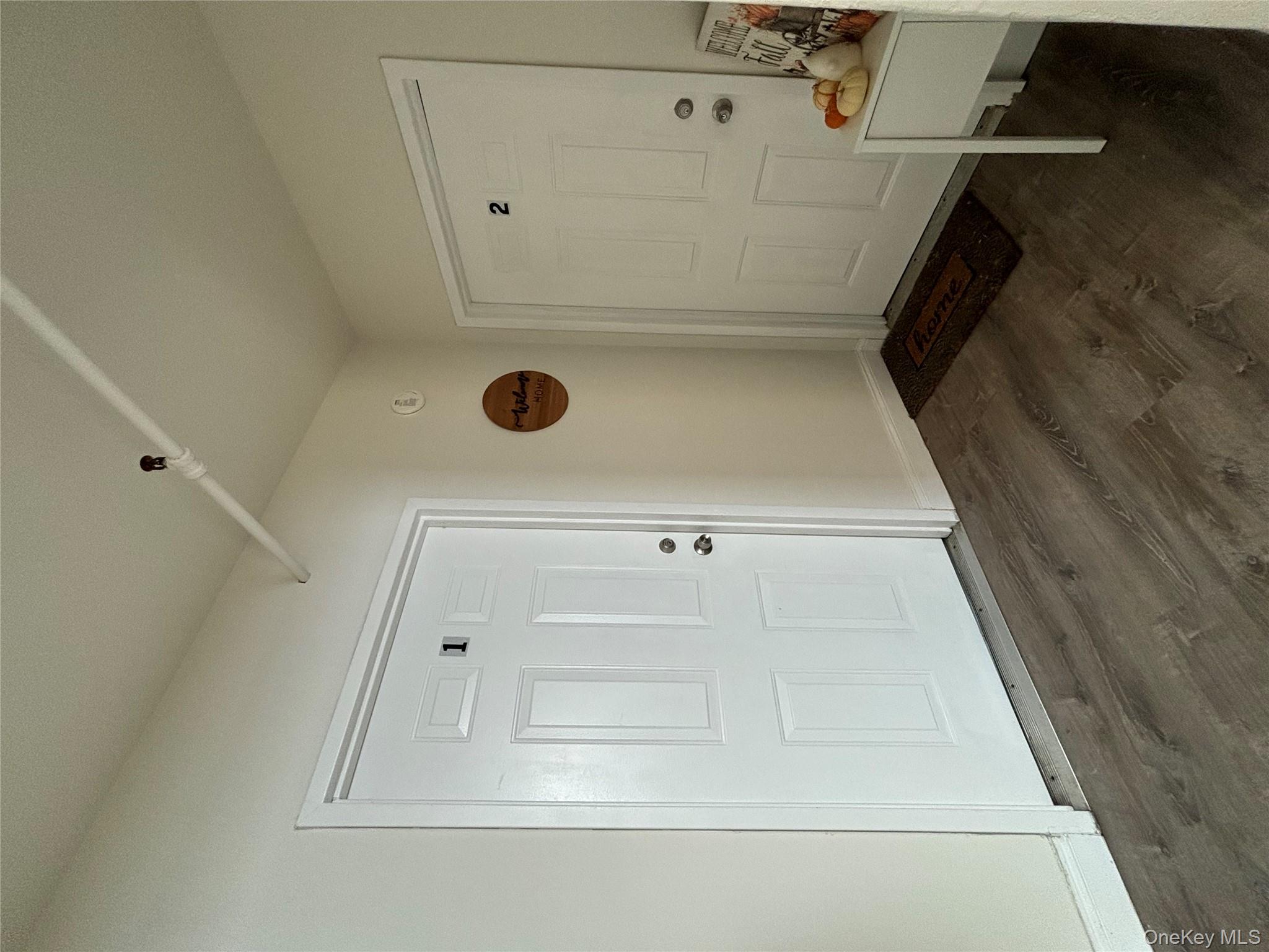 90 East Main Street, Unit 2 Patchogue, NY 11772 - Photo 3 of 14 a view of a livingroom with wooden floor