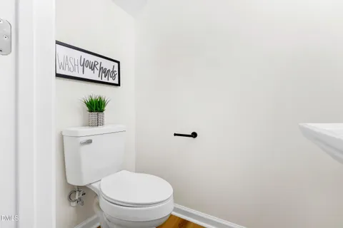 a bathroom with a toilet and a sink