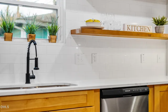 a kitchen with a sink and a window
