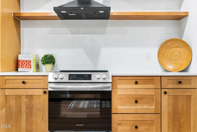 a kitchen with a stove and a cabinet