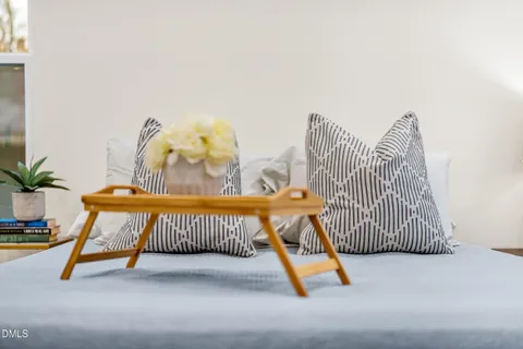 a bench sitting in patio next to a window