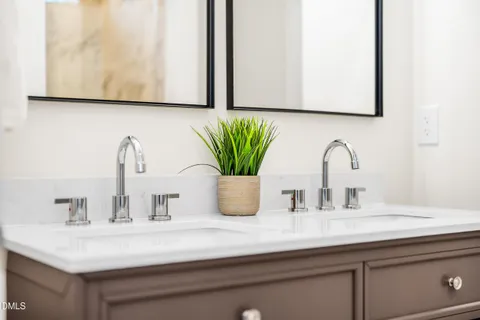a bathroom with sink and a mirror