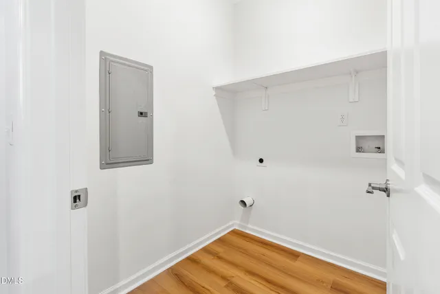 a view of a room with wooden floor