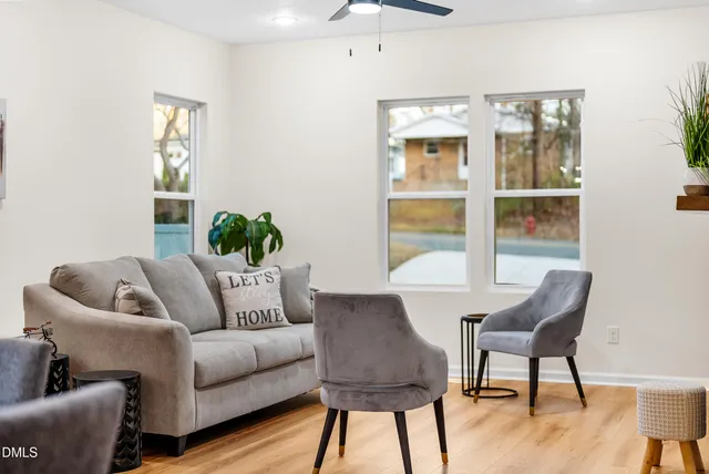 a living room with furniture and a window