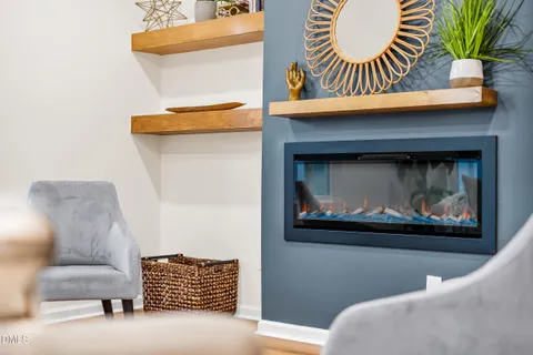 a living room with a couch and a fireplace