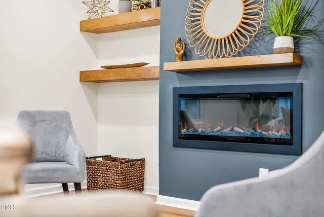 a living room with a couch and a fireplace
