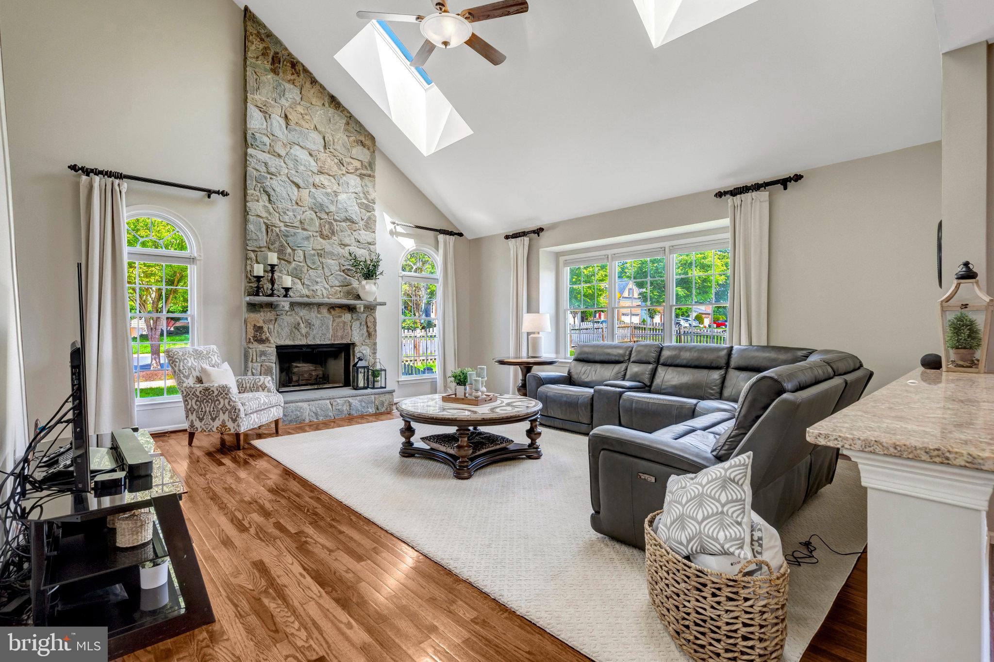 43058 Olive Tree Lane Chantilly, VA 20152 - Photo 3 of 27 a living room with furniture fireplace and a table