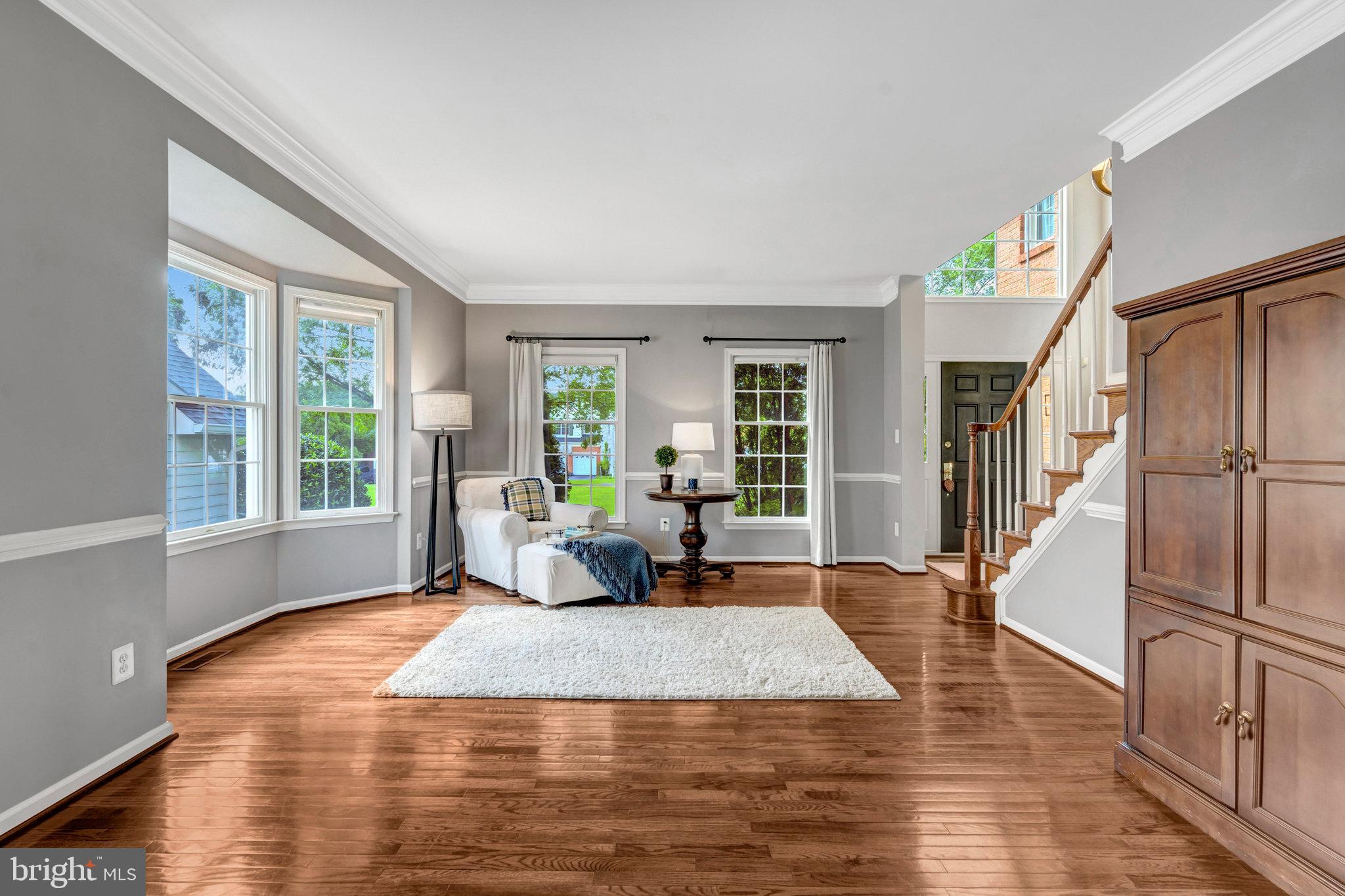 43058 Olive Tree Lane Chantilly, VA 20152 - Photo 7 of 27 a large white bed sitting in a room next to a window