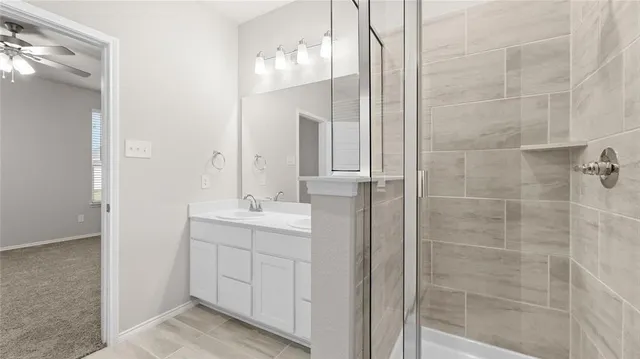 a bathroom with a double vanity sink and mirror