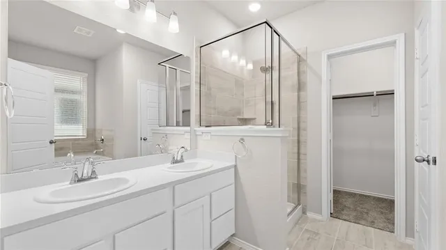 a bathroom with a double vanity sink mirror and double