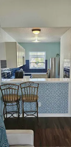 a view of livingroom with hardwood floor and a ceiling fan