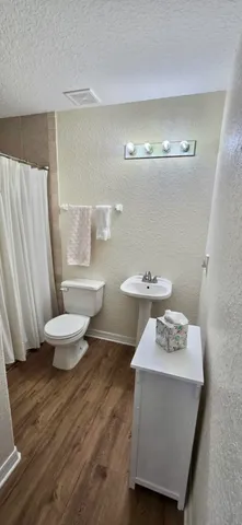 a view of a backyard with sitting area