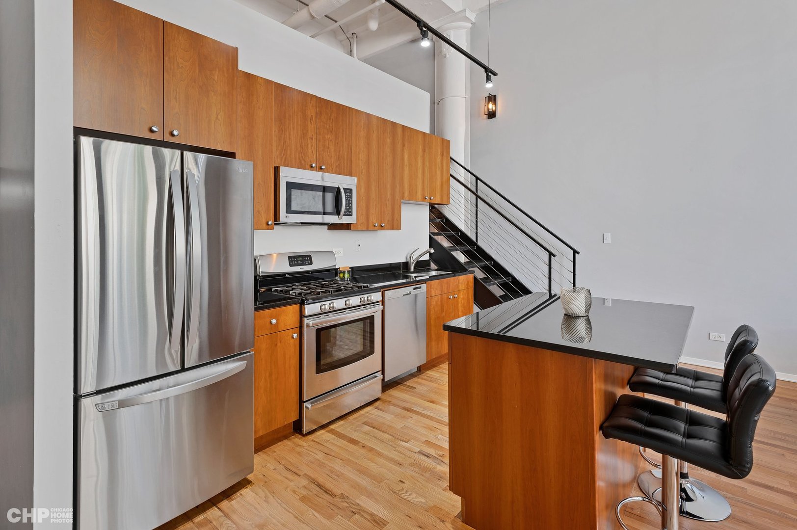 2000 South Michigan Avenue, Unit 107 Chicago, IL 60616 - Photo 11 of 30 a kitchen with stainless steel appliances a refrigerator sink and microwave