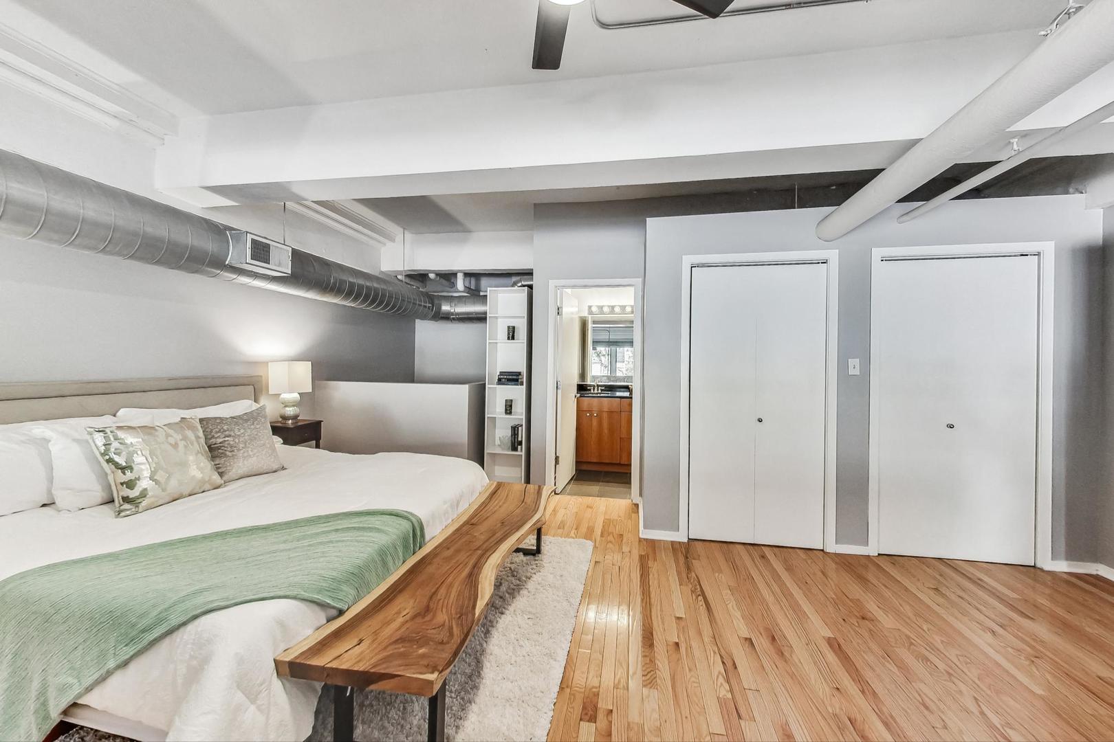 2000 South Michigan Avenue, Unit 107 Chicago, IL 60616 - Photo 14 of 30 a bedroom with a bed and a table