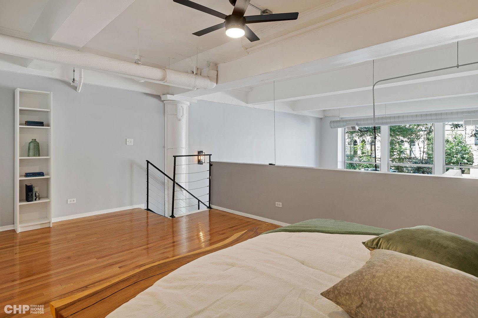 2000 South Michigan Avenue, Unit 107 Chicago, IL 60616 - Photo 15 of 30 a view of room with window and wooden floor