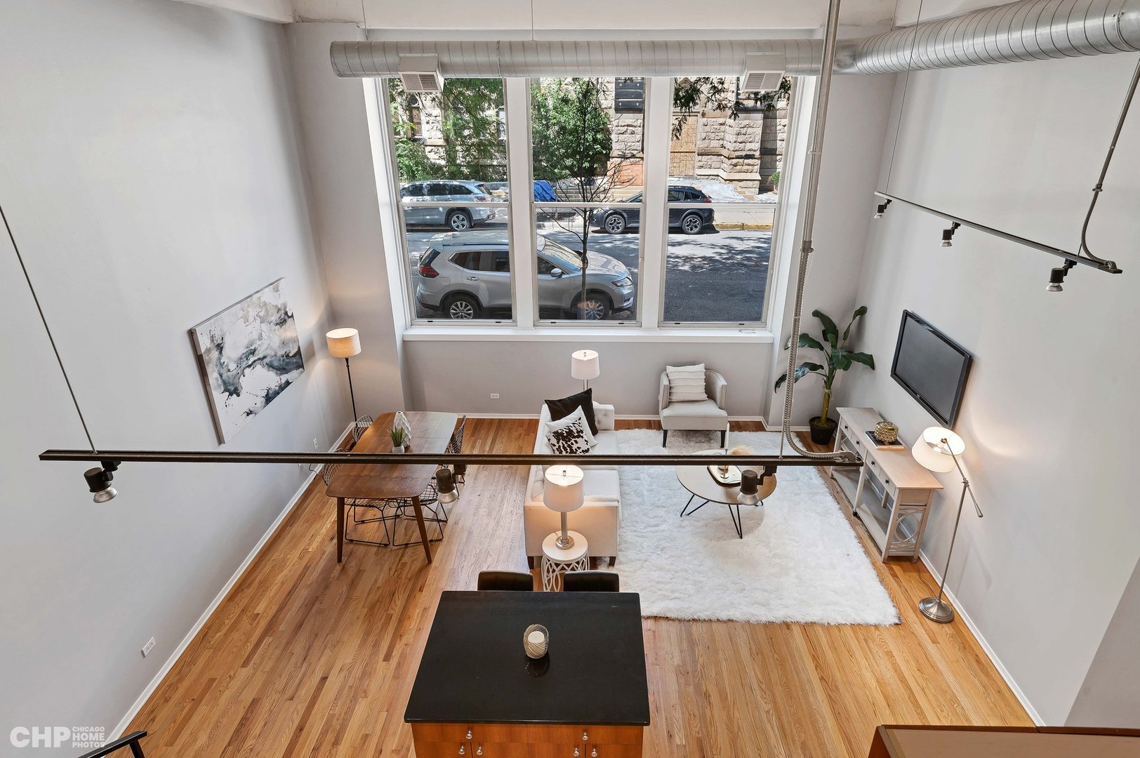 2000 South Michigan Avenue, Unit 107 Chicago, IL 60616 - Photo 16 of 30 a living room with furniture and a flat screen tv