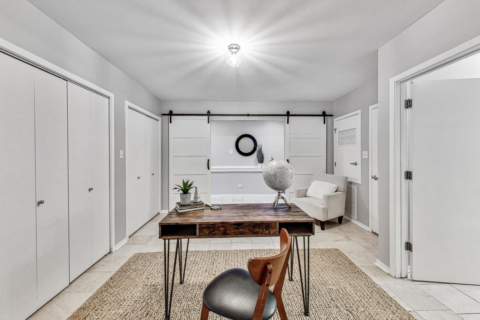 2000 South Michigan Avenue, Unit 107 Chicago, IL 60616 - Photo 19 of 30 a living room with furniture and a window