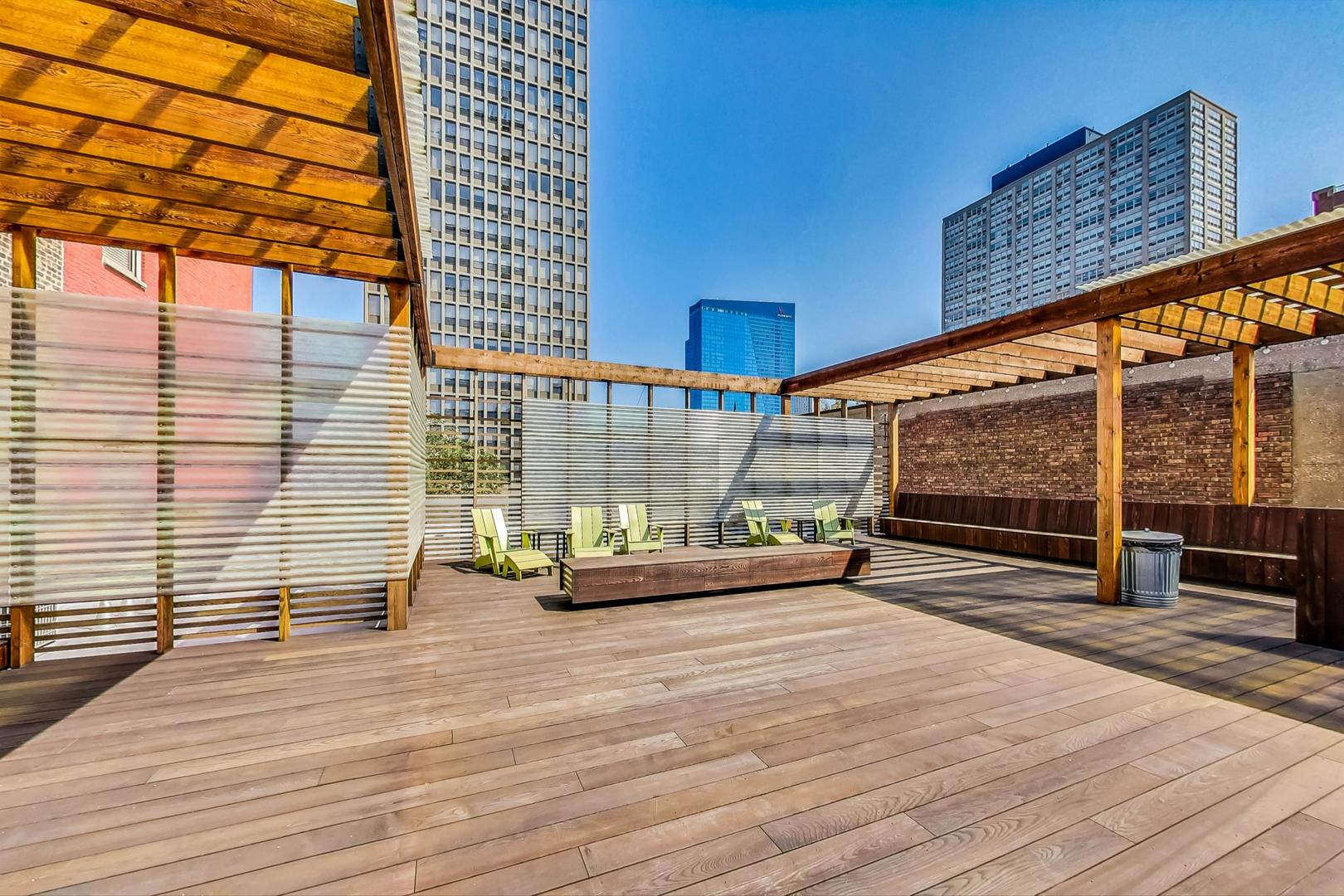 2000 South Michigan Avenue, Unit 107 Chicago, IL 60616 - Photo 28 of 30 a view of a patio with wooden floor and iron stairs